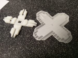 The base of the button and printed support material