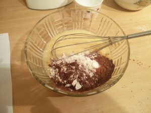 The cocoa flour mix in the same bowl as the egg mix