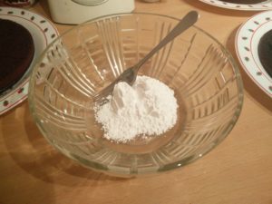 The confectioners sugar in the mixing bowl