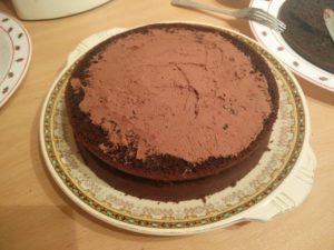 The whipping cream spread over the second cake layer