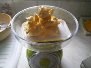 A tower of butter being weighed