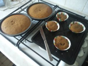 The cakes out of the oven, cooling on a rack