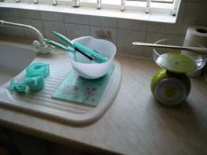 The baking utensils on a work surface, with the scales