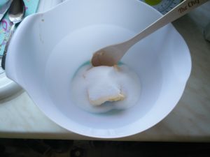 A mixing bowl with butter and sugar