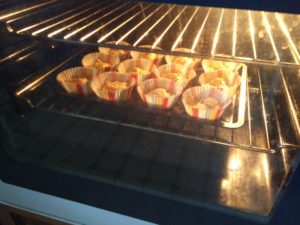The cakes in the oven beginning to bake