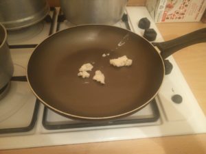 The frying pan with the vegetable shortening in