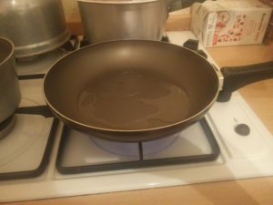 The vegetable shortening has melted in the frying pan