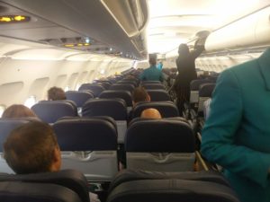 Looking down the plane showing a majority of seats empty