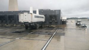 A shuttle bus parked up at the terminal building
