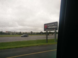 A sign at the side of the road welcoming visitors to Virginia