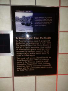 Information display explaining how spies in scientific labs passed on information to the Soviet Union