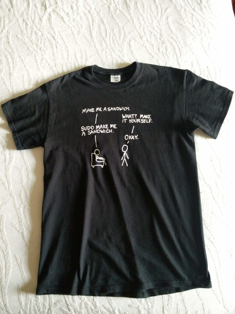 A photo of the xkcd "sudo" t-shirt