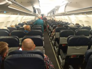 The inside of the plane to Birmingham, with a majority of seats filled