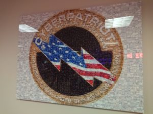 The CyberPatriot logo created from a mosaic of other images