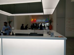 The reception area of Plexal, with the name showing in the background